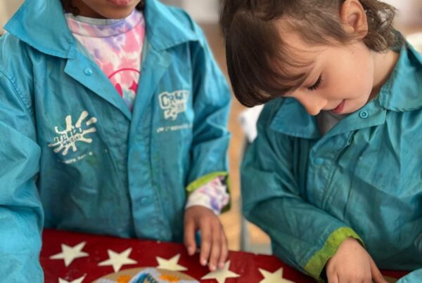 Group of children collaborating on a themed art project