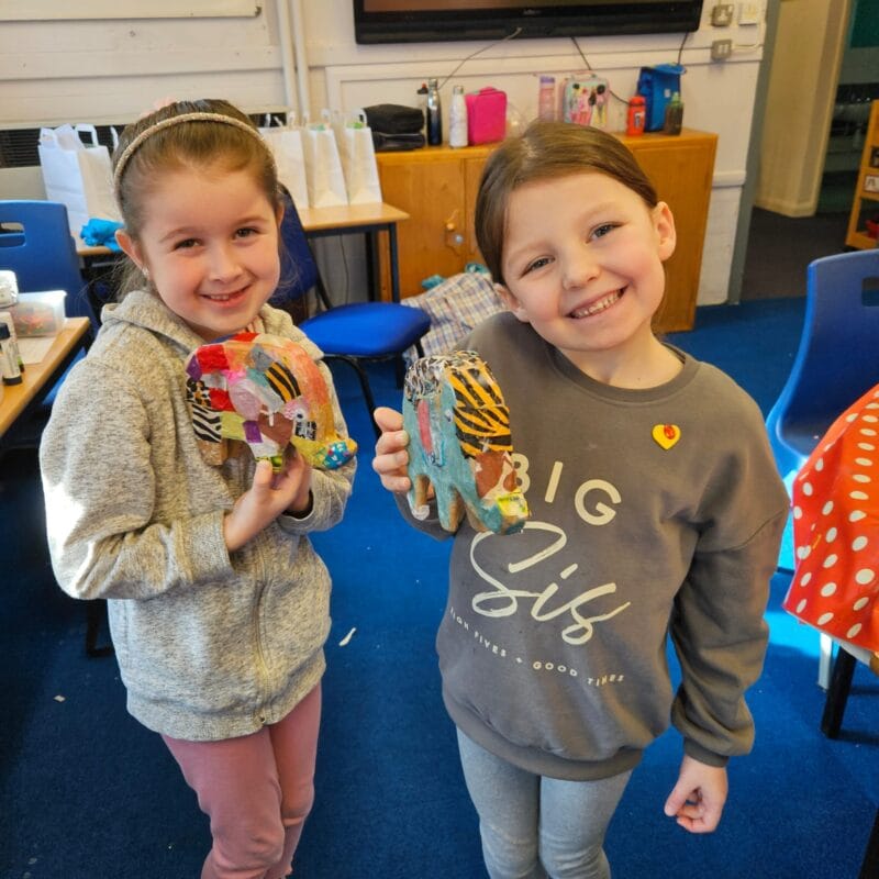 Children enjoying hands-on activities at a creative holiday club.