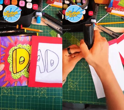 Child colouring a comic-style ‘DAD’ drawing for a Father’s Day magic card craft