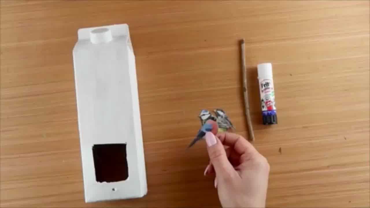 painted DIY bird feeder made from upcycled packaging