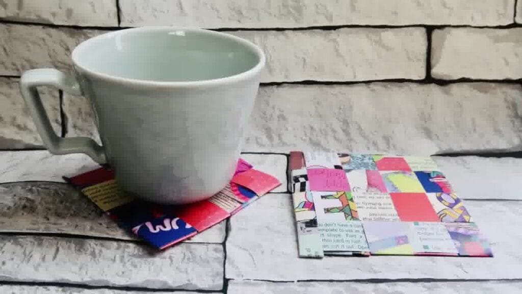 Finished recycled magazine coaster showing a colourful woven pattern