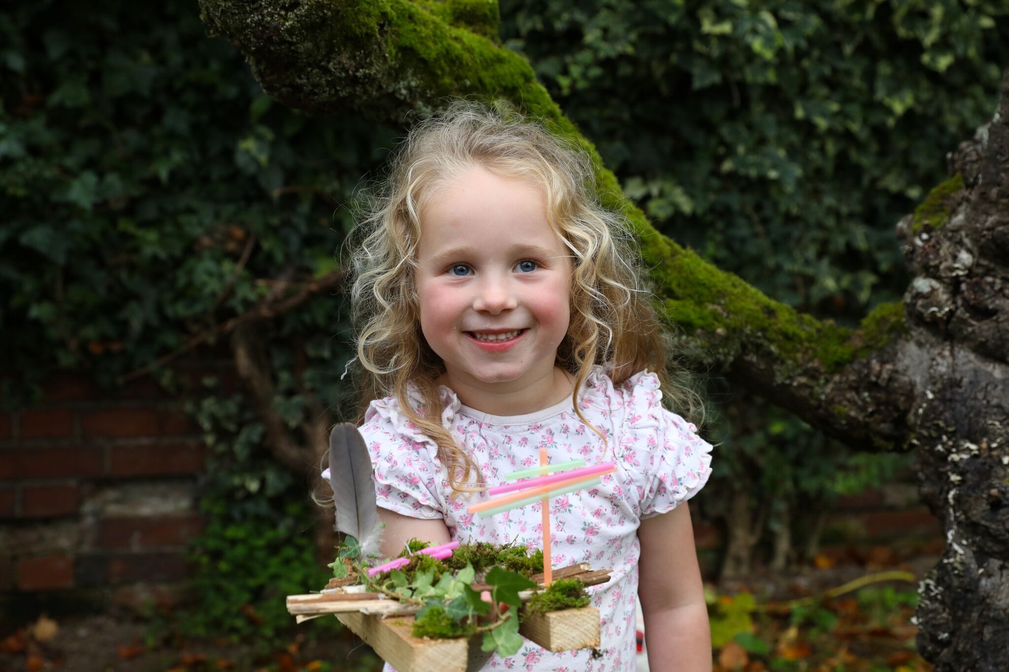 Children enjoying eco-friendly craft activities outdoors for the Creative Summer Challenge
