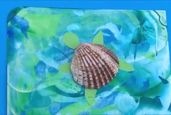 Scrape art turtle assembled with colourful shell and smiling face.