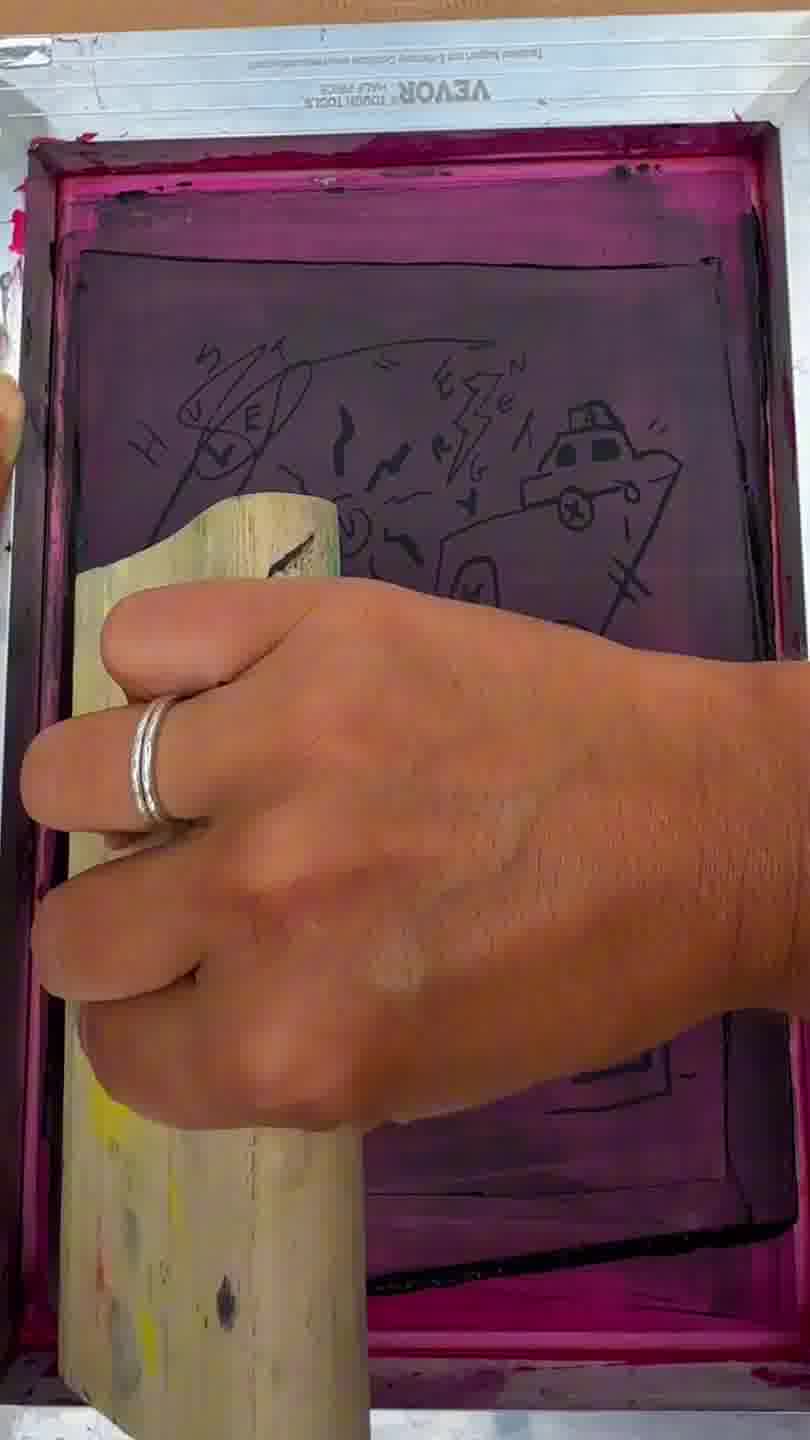 Close-up of screen printing a t-shirt design