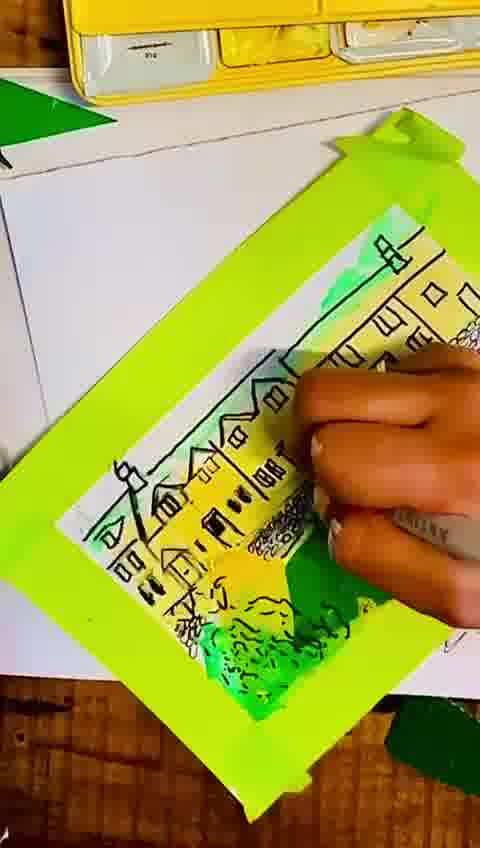 Adding stickers and glitter to a colourful handmade postcard design