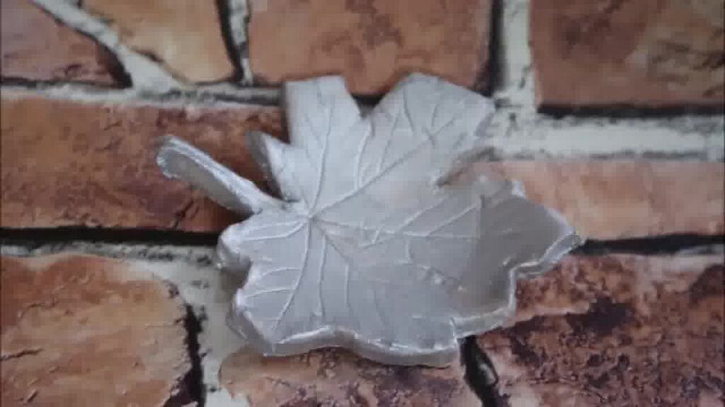 Completed green leaf-shaped clay dish, ready for jewellery or trinkets.