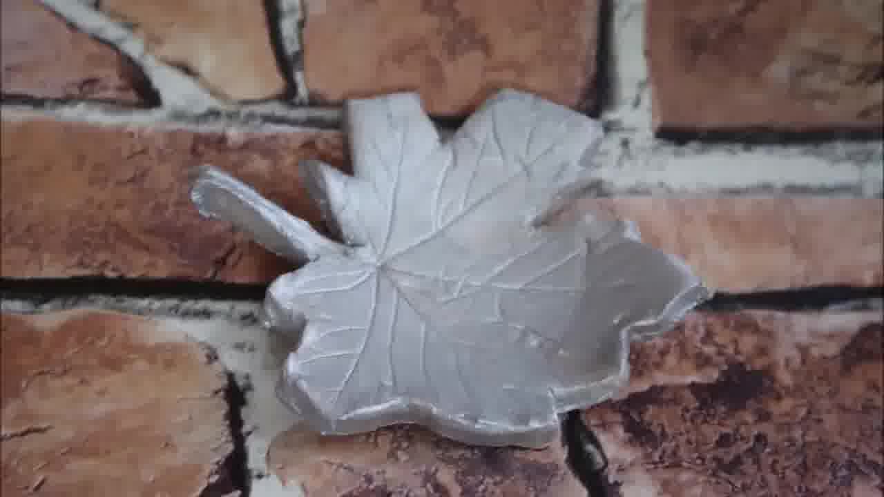 Completed green leaf-shaped clay dish, ready for jewellery or trinkets.