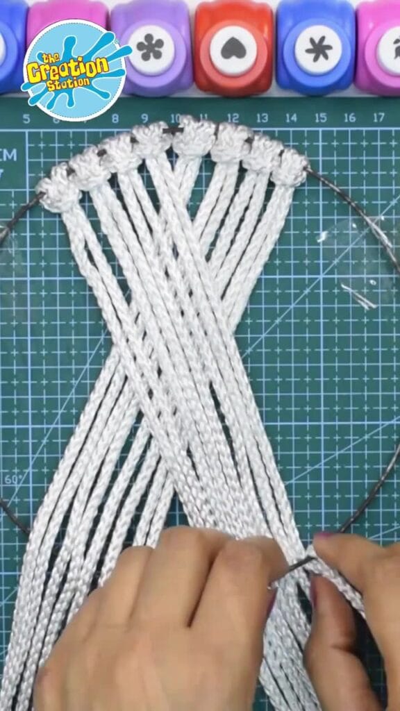 Handmade macrame wall hanging with intricate knots.