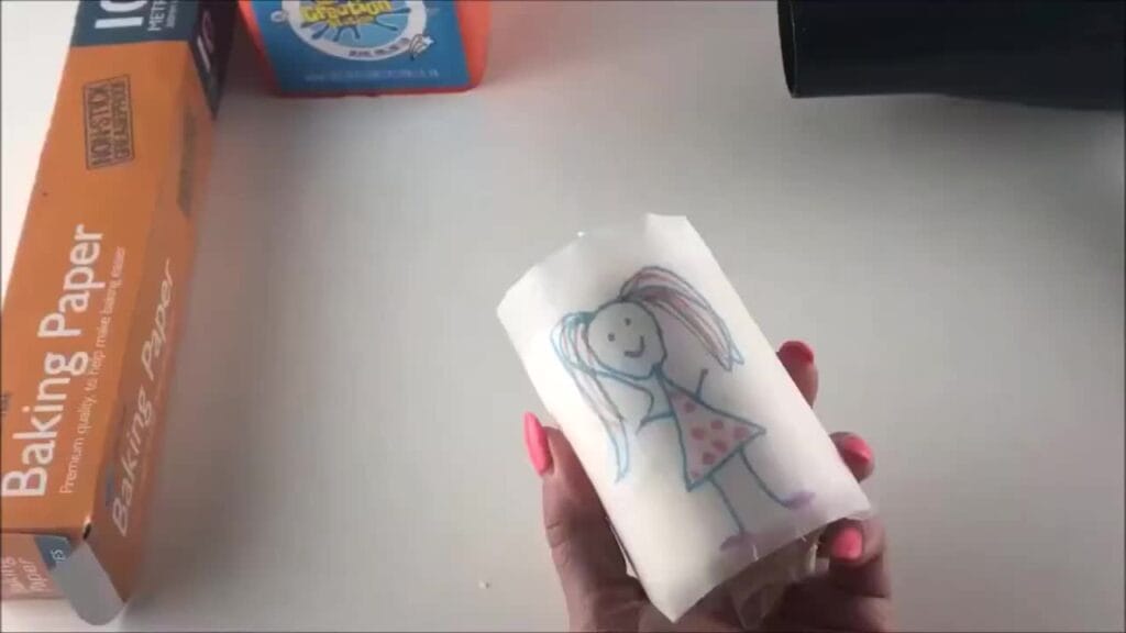 Decorated candle being created by hand
