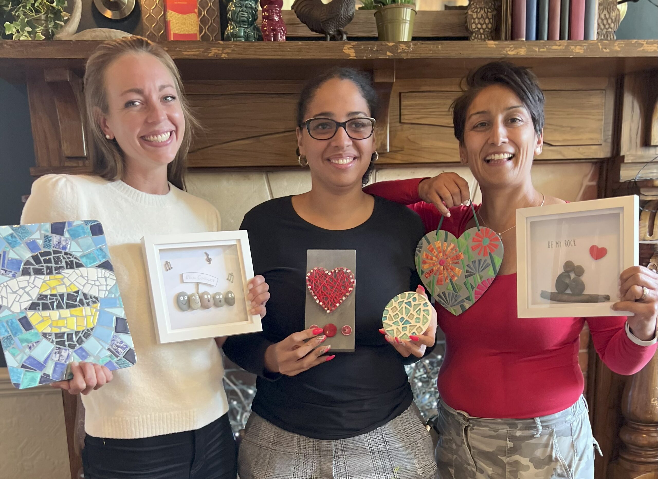 People enjoying a creative activity with their handmade crafts