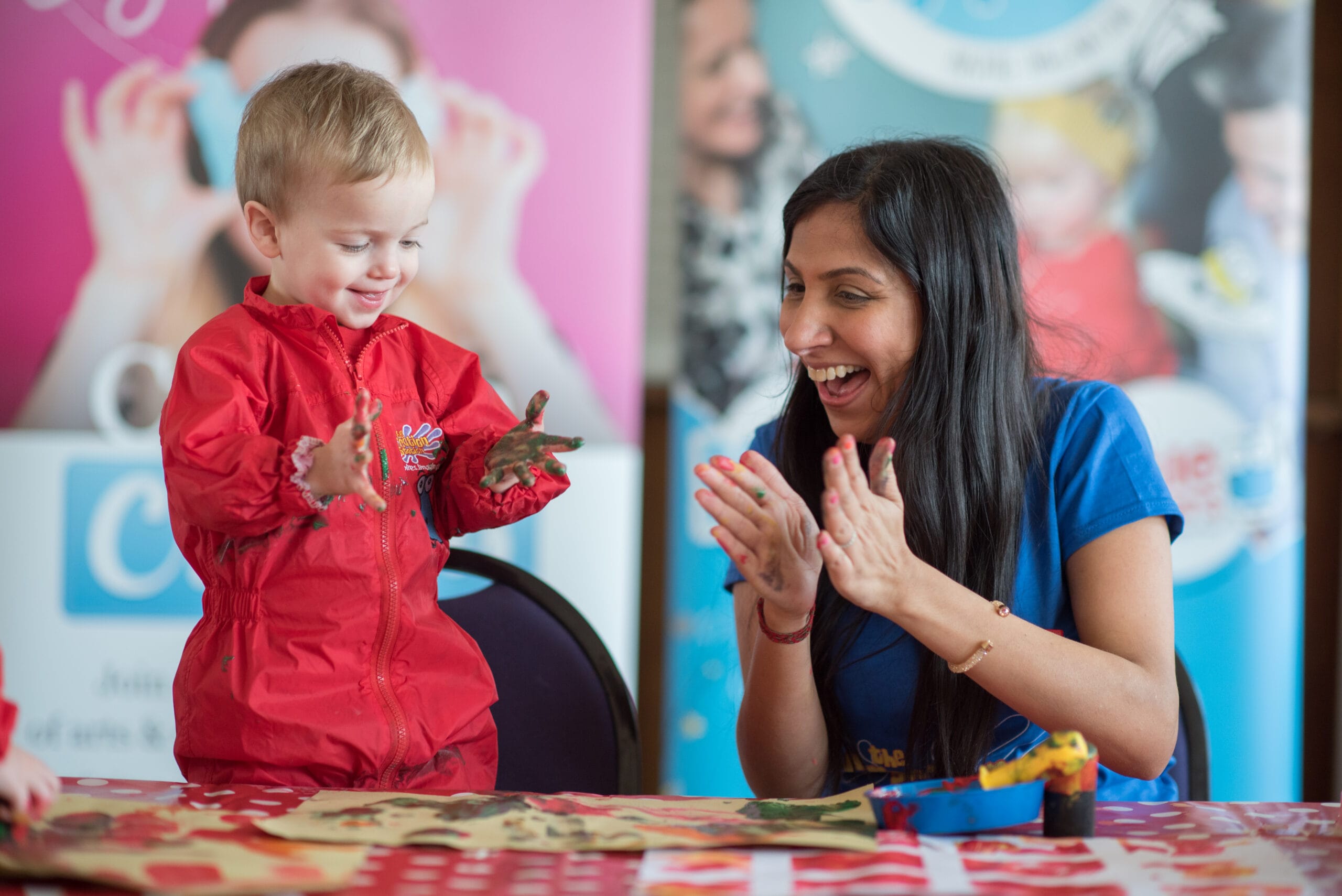 Toddlers enjoying hands-on arts and crafts activities at the Totally Tots holiday