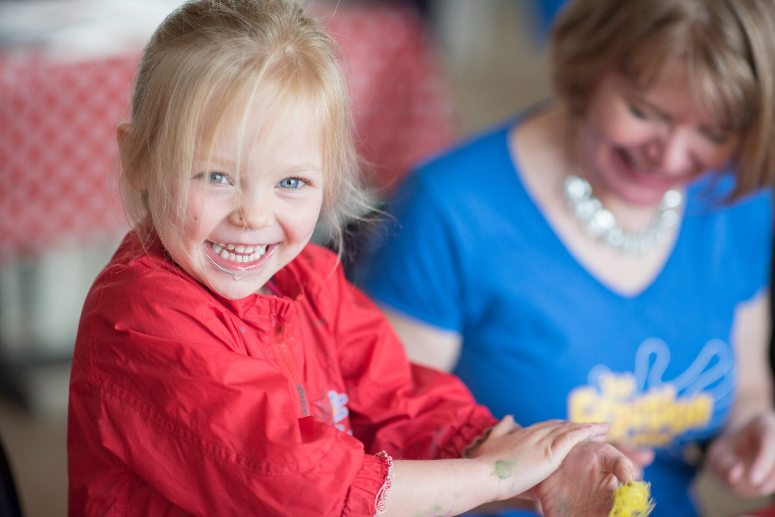 Young children painting during a creative family holiday with The Creation Station