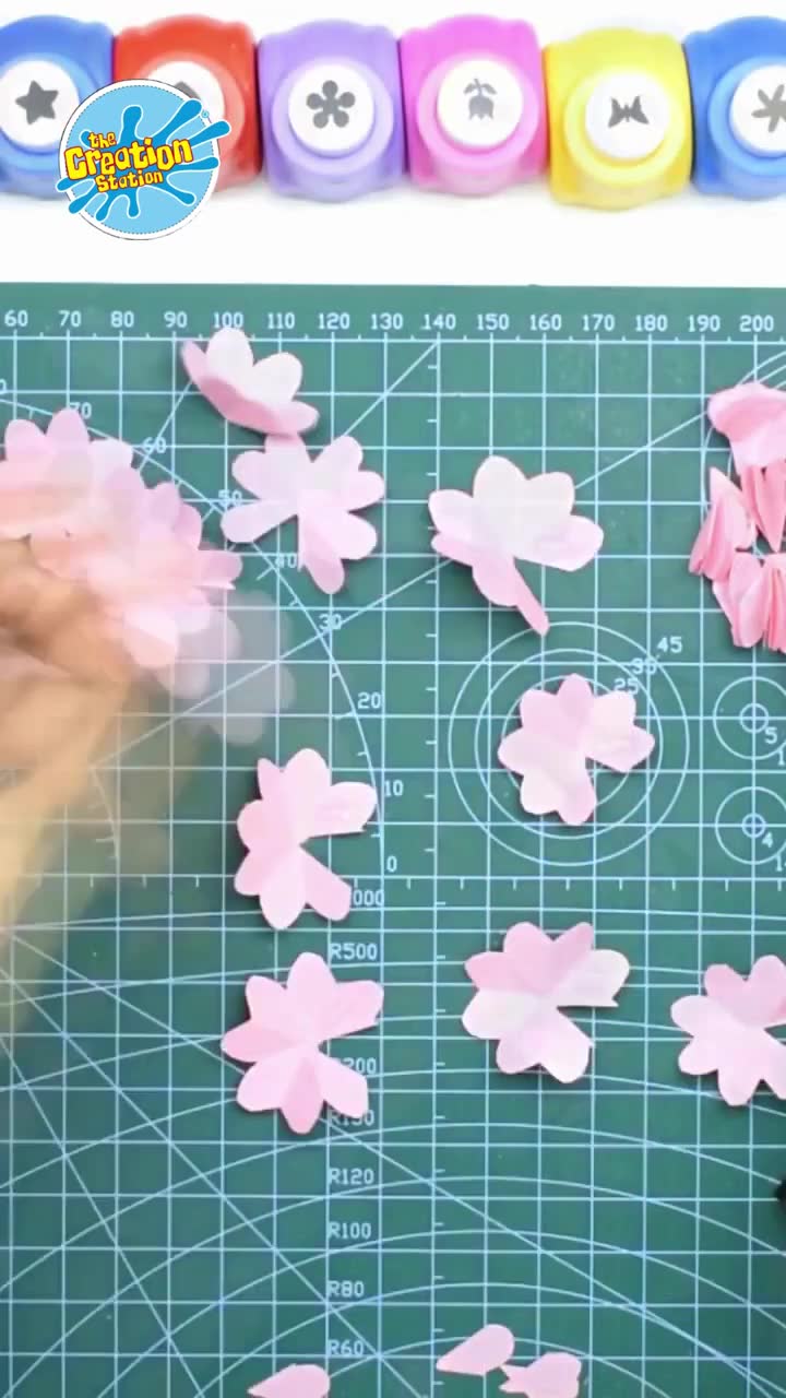 Petals being folded, curled, or shaped to give dimension and a natural look
