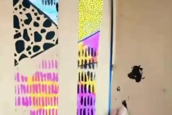 using pens, pencils, or watercolours to add colour and texture to pages
