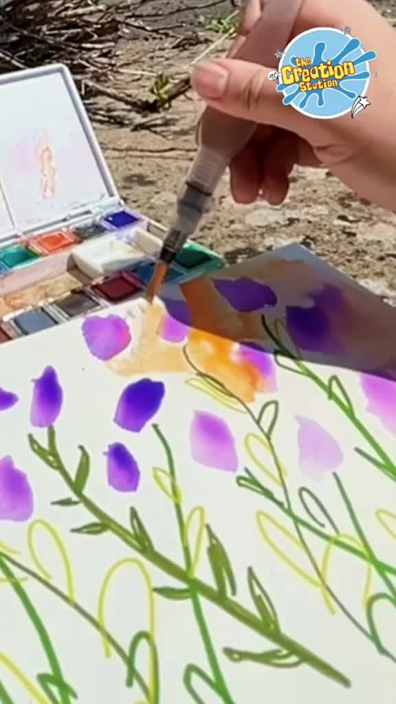 Watercolour pen, water jar, brush, and paper ready to paint lavender flowers