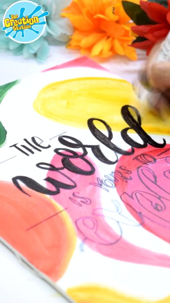 Calligraphy pen creating elegant, flowing letters on paper using smooth strokes