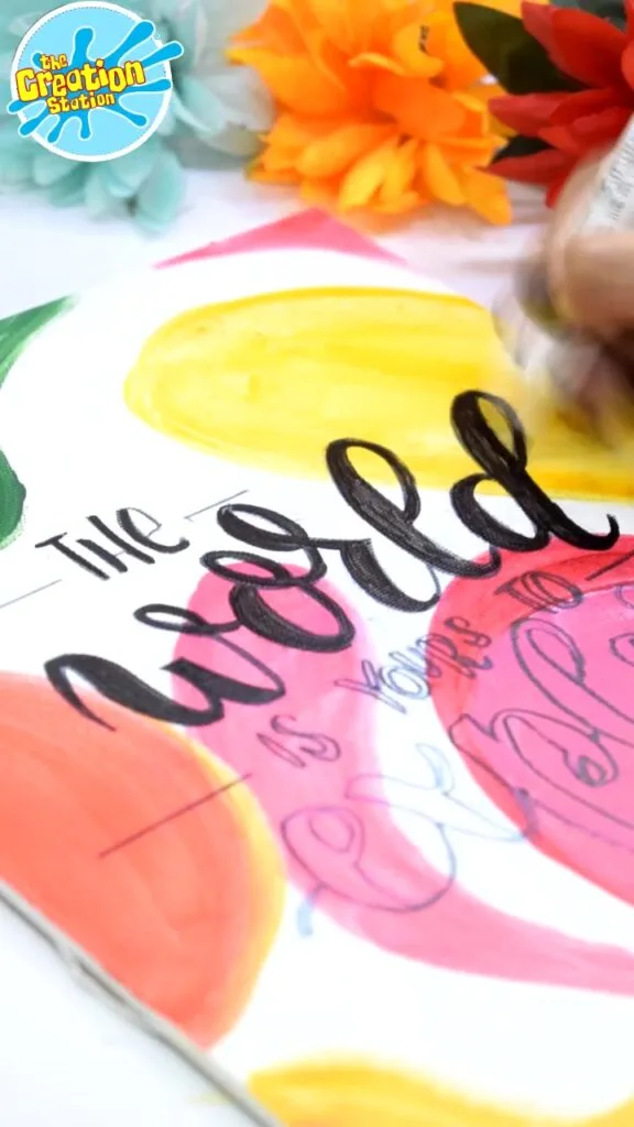 Calligraphy pen creating elegant, flowing letters on paper using smooth strokes