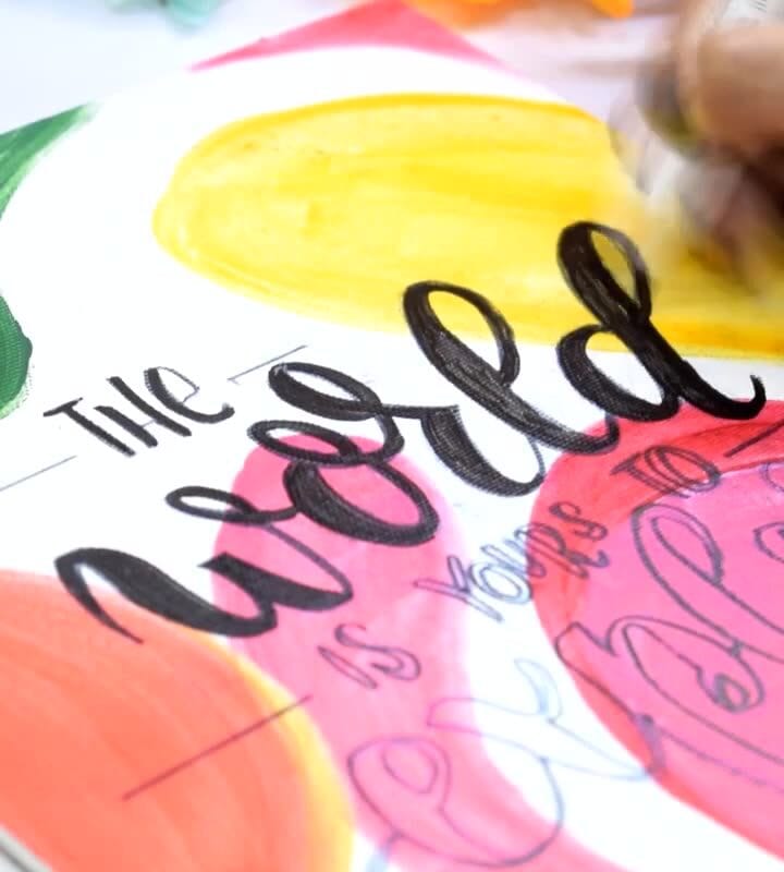 Calligraphy pen creating elegant, flowing letters on paper using smooth strokes