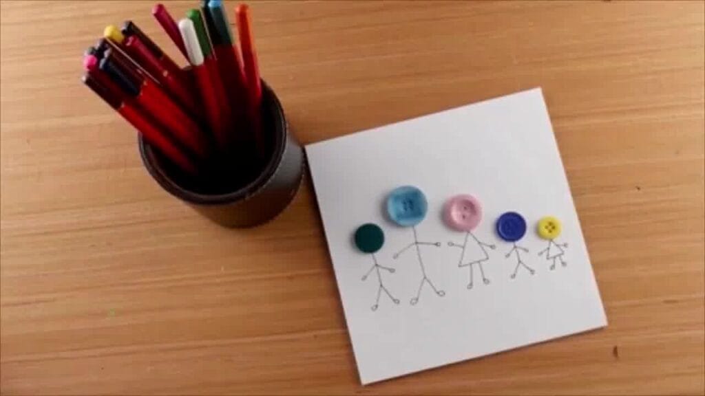 Completed button art featuring a colourful, textured design on canvas