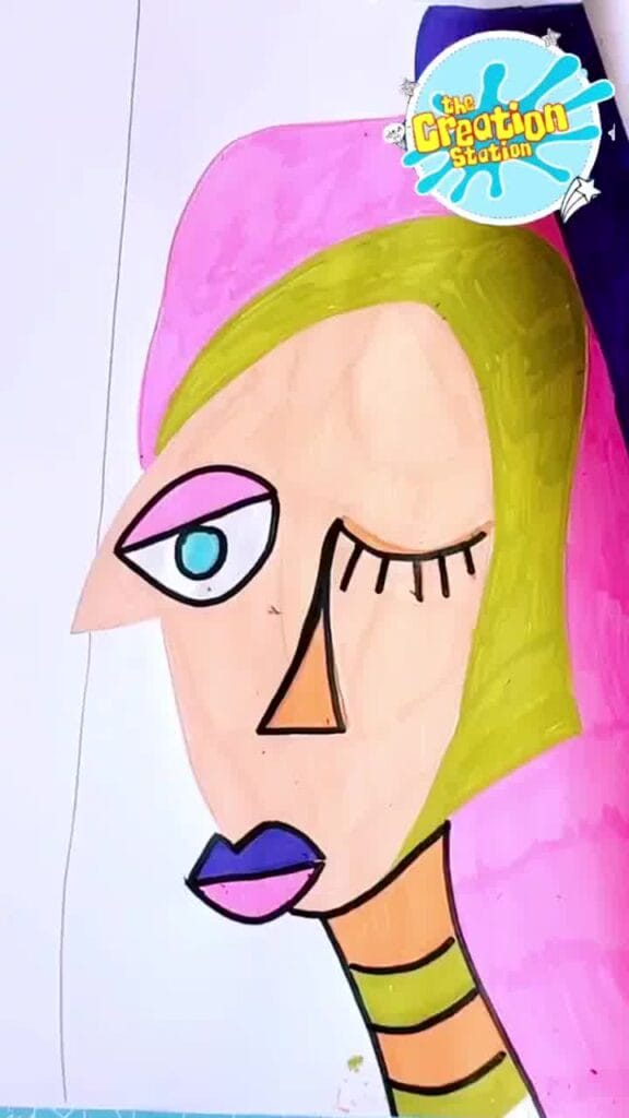 Artist outlining shapes in black to make features stand out and enhance the Picasso-inspired look