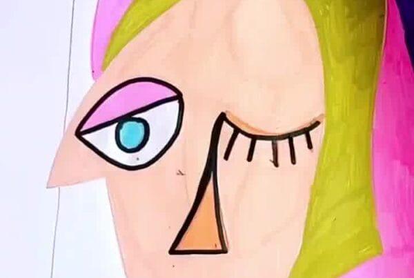 Artist outlining shapes in black to make features stand out and enhance the Picasso-inspired look