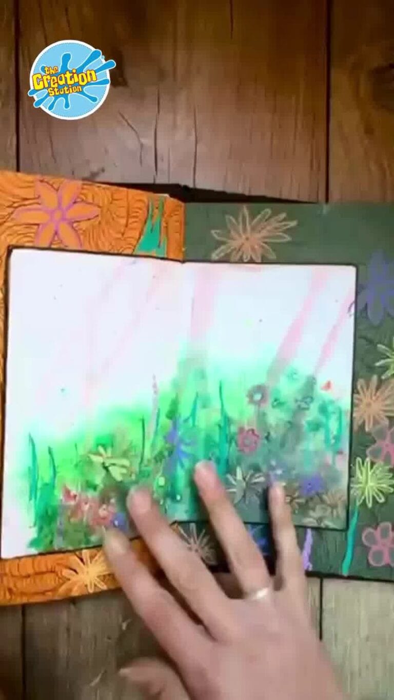 Completed sketchbook open to a page filled with colourful sketches, doodles, and personalised touches