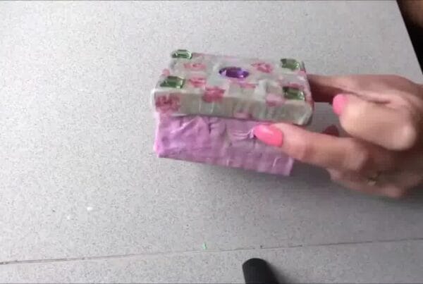 Completed decoupaged item with smooth, glossy layers and decorative patterns