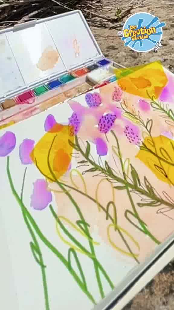 Water and brush used to blend the purple flowers, adding depth and variation in colour