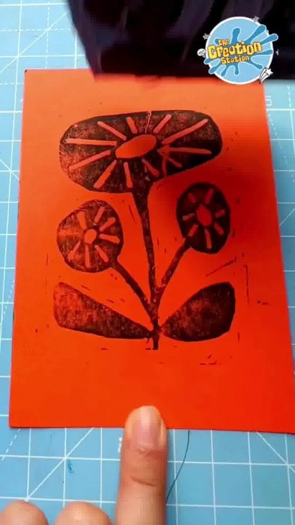 Completed lino print artwork showing crisp, bold patterns made from the carved block